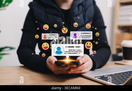 Social media marketing concept. Person holding smartphone with floating emoji icons and chat notification bubbles, representing online communication, Stock Photo
