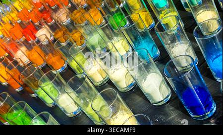 Colorful pigment powders in glass vials arranged for scientific color analysis and precise material sampling. Stock Photo