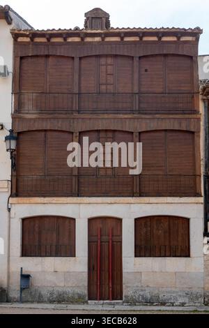 Traditional house in the historic Plaza del Coso, Peñafiel, Spain. This iconic building features unique wooden balconies, rustic shutters. Stock Photo
