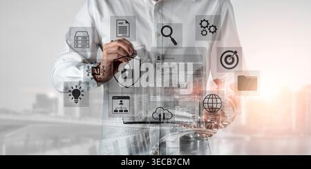A professional man engages with a digital tablet surrounded by various technology and security icons, illustrating modern business concepts and innova Stock Photo