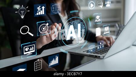 Businesswoman Using Laptop with Artificial Intelligence Graphics and Data Analysis Icons for Modern Technology and Innovation in Business Environments Stock Photo