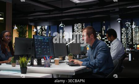 Stressed man in company workplace worried by glitches while doing artificial intelligence tech quality assurance. Anxious admin in office struggling with AI programming languages script Stock Photo