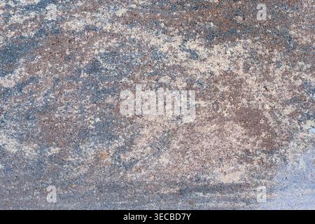 Texture of artificial dark gray granite with light, sand-colored veins. Rough stone surface as a backdrop for architectural design, 3D visualization, Stock Photo