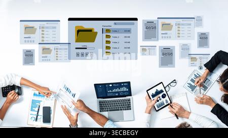 A modern business workspace featuring digital devices, data analysis tools, and collaborative teamwork. The environment emphasizes productivity and ef Stock Photo