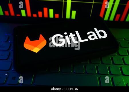 GitLab DevOps Platform Company Logo Displayed On Digital Screen With Software Development And Cloud Engineering Background Stock Photo