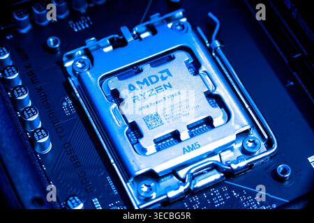 AMD Ryzen 7900x Processor Chip Installed In Cpu Socket On Computer Motherboard Stock Photo