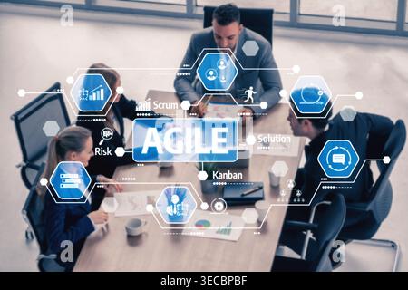 Team in a business meeting engaged in an agile methodology discussion, focusing on strategies, risks, and solutions using scrum and kanban concepts wi Stock Photo