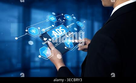 A businessman interacts with a digital tablet displaying advertising metrics and marketing analytics, showcasing the integration of technology in mode Stock Photo