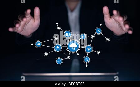 A business professional showcases an innovative cloud technology concept as hands gesture towards a virtual display of digital connections and icons r Stock Photo