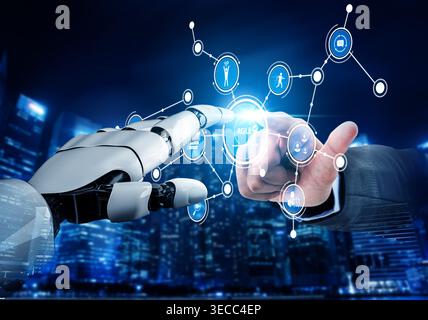 A stunning visual of a robotic hand reaching out to connect with a human finger, surrounded by digital icons. This image illustrates the future of hum Stock Photo