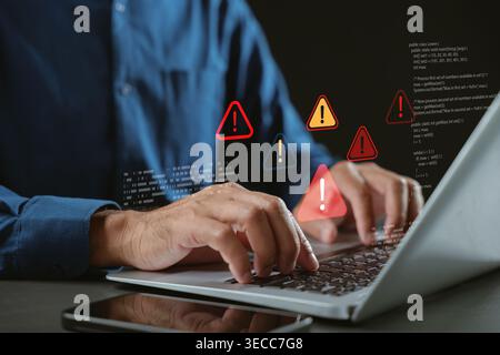 Warning computer cybersecurity threats hacking ransomware phishing triangle caution signs appear while user types on laptop, representing spyware cybe Stock Photo
