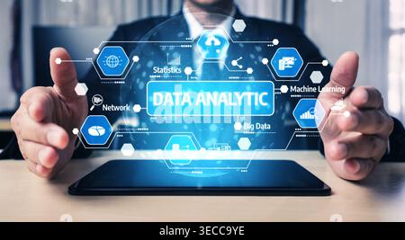 A business professional showcases a data analytic concept, featuring icons of statistics, network, and machine learning in a modern office setting. Te Stock Photo