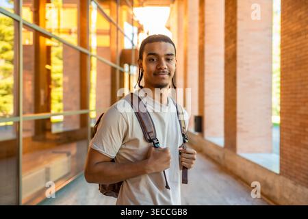 Young student smiling confident on modern university campus Stock Photo