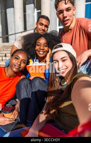 Diverse students taking a selfie on university campus Stock Photo