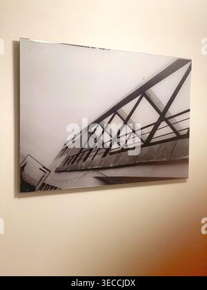 Moscow, Russia- October 9 2021: Framed black and white photograph of modern architecture on minimal wall interior Stock Photo