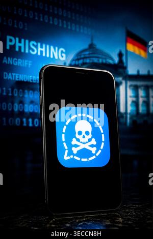 Symbolfoto zur Cyber-Spionage auf Signal: Ein Smartphone zeigt eine manipulierte Version des Messenger-Logos mit Totenkopf-Symbol. Illustration der großangelegten Phishing-Angriffe auf deutsche Regierungsmitglieder und Parlamentarier im Frühjahr 2026. *** Symbolic image illustrating cyber espionage on Signal: a smartphone displaying a manipulated version of the messaging apps logo featuring a skull and crossbones. Illustration of the large-scale phishing attacks targeting German government officials and MPs in spring 2026. Nordrhein-Westfalen Deutschland, Germany 20260430-DSCF3269 Stock Photo