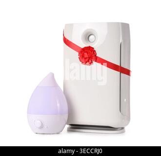 Modern humidifier and air purifier with ribbon isolated on white background Stock Photo