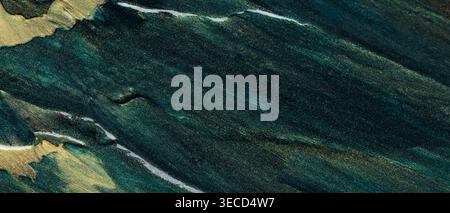 Dark teal and gold abstract textured background with flowing marble patterns and metallic accents Stock Photo