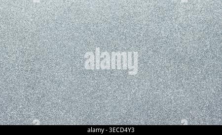 Light gray textured glitter background with fine grain pattern for minimalist design Stock Photo