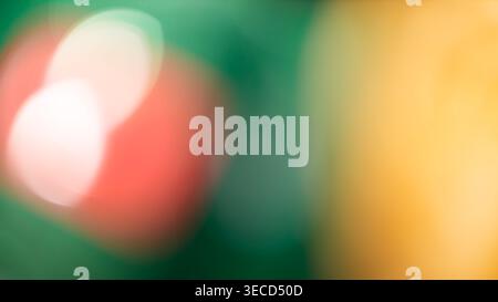 Abstract defocused bokeh background with green red and yellow light spots Stock Photo