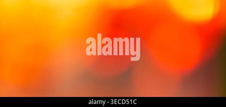 Vibrant orange and red gradient abstract background with warm fiery tones and copy space Stock Photo
