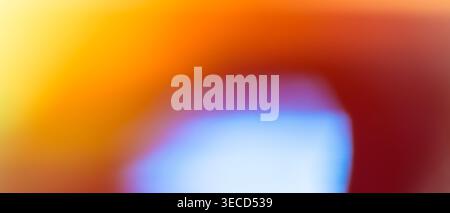 Vibrant abstract background with blue and purple bokeh glow on warm orange and red gradient Stock Photo