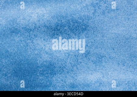 Washed light blue denim fabric texture background with faded cotton weave for casual apparel backdrop Stock Photo