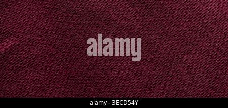 Dark burgundy knitted wool fabric texture with diagonal weave for an elegant fashion background Stock Photo