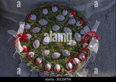 Painted chicken eggs with the 13 villages of the municipality Eckental Osterbrunnen in Eckenhaid, Eckental, Middle Franconia, Bavaria, Germany Stock Photo