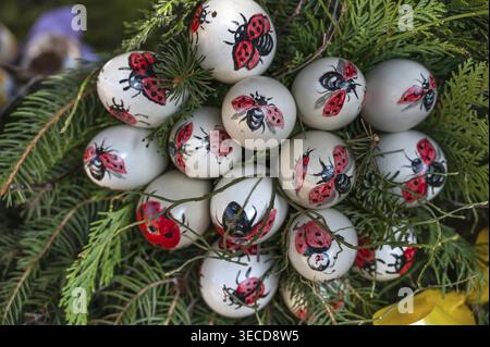 Hand-painted chicken eggs with ladybirds at Easter fountain in Eckenhaid, customs in Franconia, Eckental, Middle Franconia, Bavaria, Germany Stock Photo