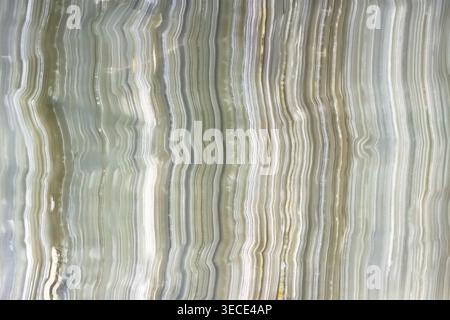 Front view of a polished green onyx marble texture with parallel vertical stripes Stock Photo