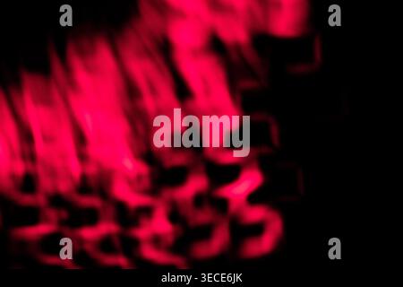 Abstract Pink Magenta and Black Grainy Texture Background with Subtle Spotlight defocused effect. High quality. Stock Photo
