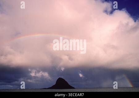 A rainbow over the Pacific ocean on the coast on Maui Island, Hawaii, USA Stock Photo