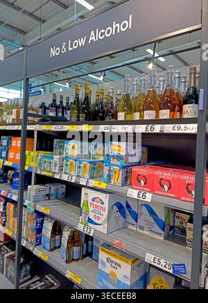 Low and no alcohol drinks range shelf in a large Tesco superstore, showing alcohol-free beer, cider and wine alternatives Stock Photo