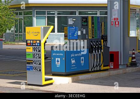 High Italian petrol station prices per litre, with diesel, super, diesel plus and HVOlution displayed during oil market tension. Stock Photo