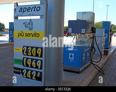 High Italian petrol station prices per litre, with diesel, super and diesel plus shown on a forecourt fuel sign during oil market tension. Stock Photo