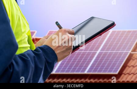 Solar panels,engineer installing solar panels and clean energy with digital tablet Stock Photo