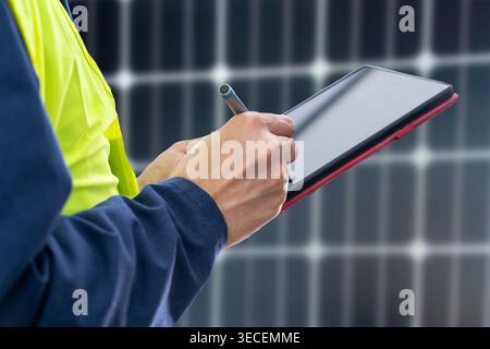 Solar panels,engineer installing solar panels and clean energy with digital tablet Stock Photo