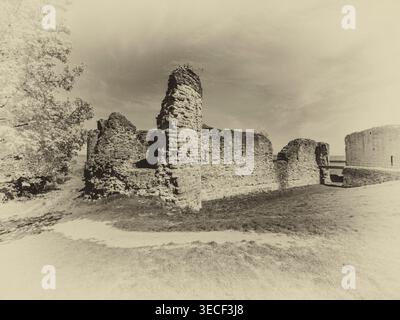 Black and white image of the abandoned medieval Flint Castle fortress [Castell Flint] at the town of Flint in North Wales Cymru on the River Dee Stock Photo