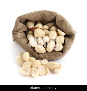 Tasty peanuts in sack isolated on white Stock Photo