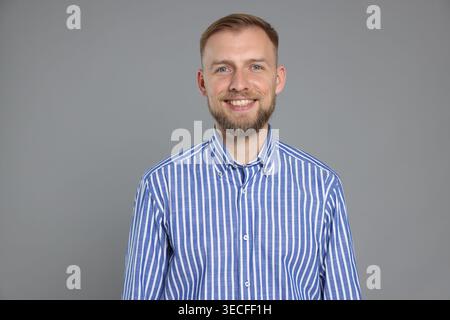 Portrait of English teacher on grey background Stock Photo