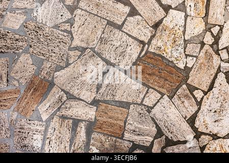 Palladiana or opus incertum flooring made from irregular fragments of natural stone, travertine, or limestone; textured background Stock Photo