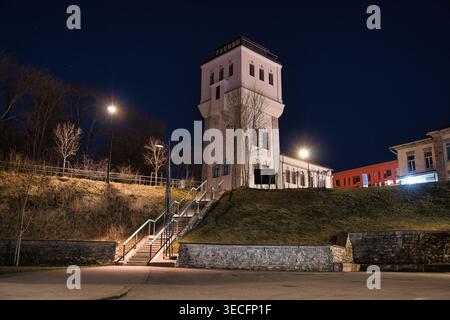 Illuminated Historic White Tower Under a Dark Starry Night Sky Stock Photo