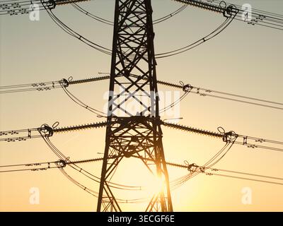Aerial view of a high-voltage electricity pylon silhouette against a golden sunset sky with intricate power lines in Armthorpe, England, United Kingdo Stock Photo