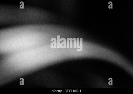 Grayscale abstract glowing light swoosh over black grainy background Stock Photo