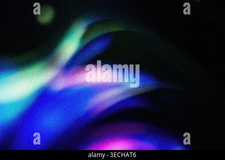 Cosmic grainy gradient background displaying colorful abstract waves in purple blue and green Stock Photo