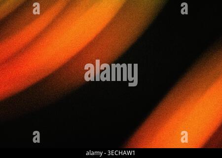 Abstract background with grainy texture and parallel diagonal orange glowing light bands on black Stock Photo