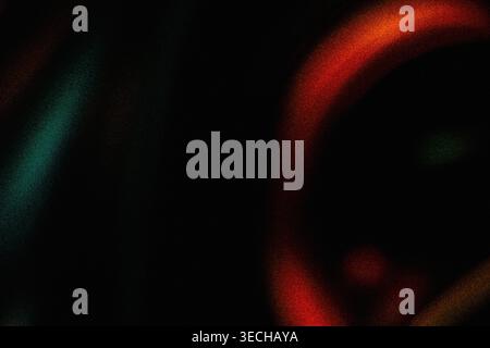 Minimalist dark grainy background with subtle red and teal light curves Stock Photo