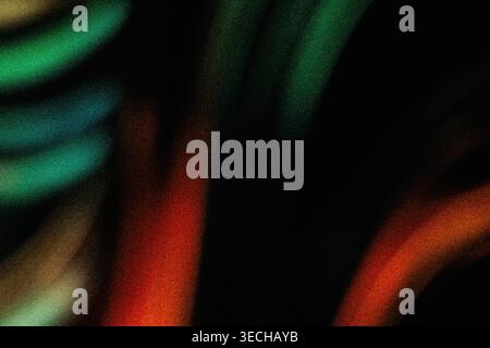 Dark abstract background with grainy green and orange luminous light leaks Stock Photo