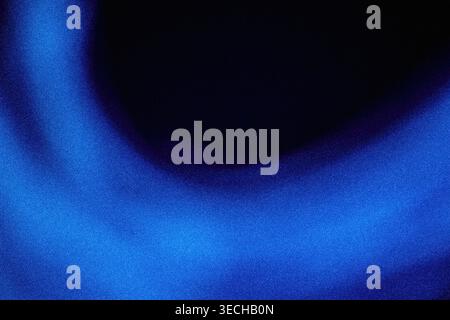 Smooth curved glowing blue neon light band with grainy texture on black background Stock Photo